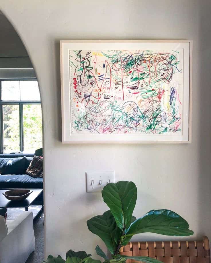 Colorful children's drawing in a frame, decor for a cozy interior.